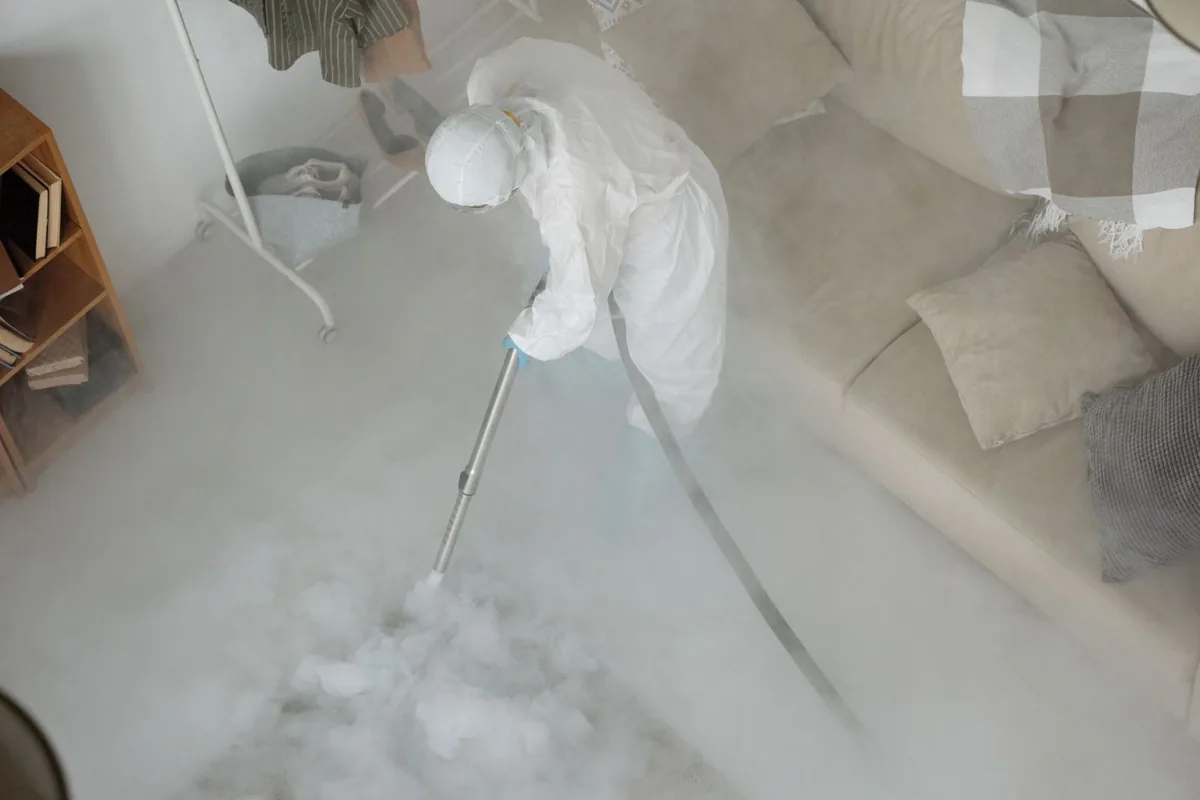 Biohazard cleanup technician in protective equipment, Homer City, PA